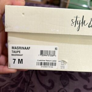 Tan heeled suede booties.